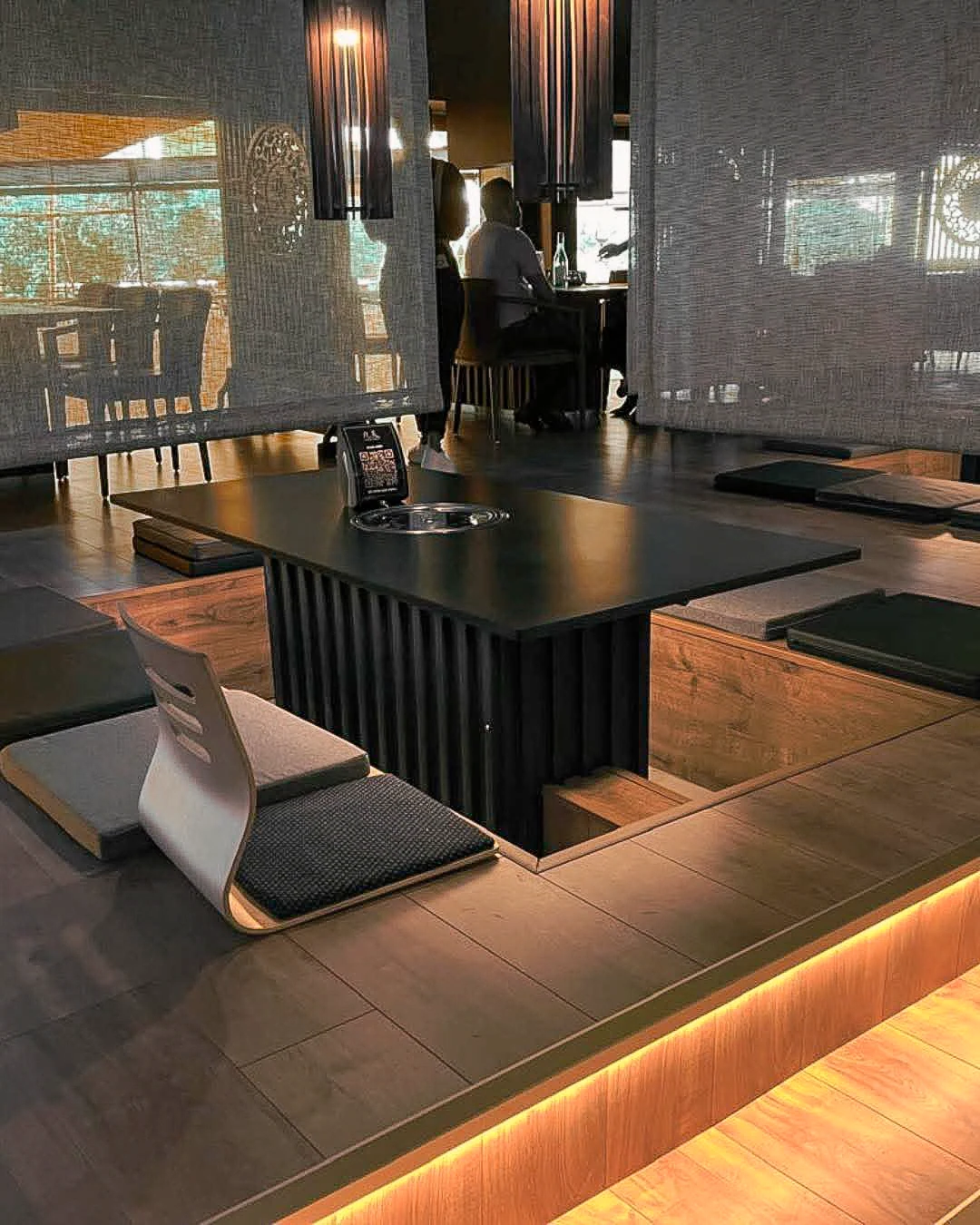 Nine Sky restaurant fit-out: woven screens, recessed seating, timber joinery and integrated warm lighting
